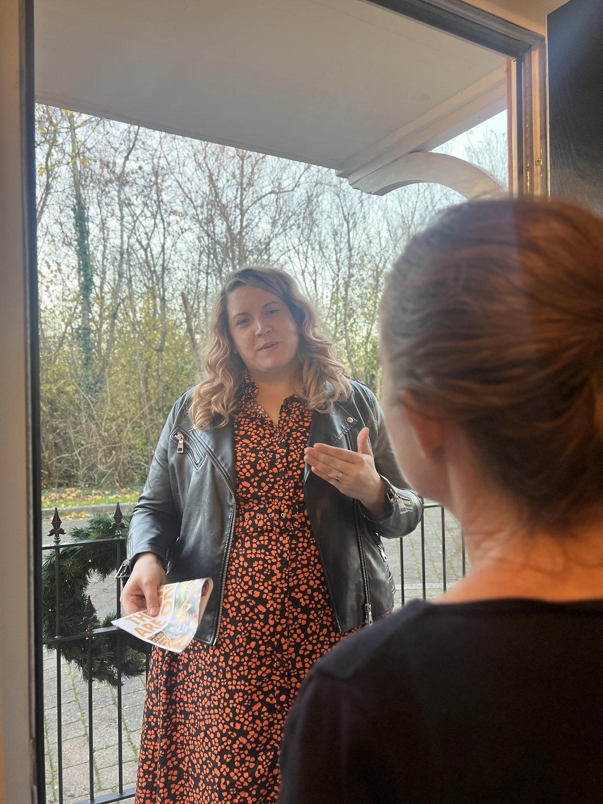 Jennie Westbrook on the doorstep talking with residents